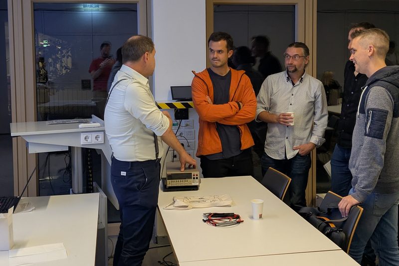 One of the groups that formed around the speakers after the talks, here with Christian and his multimeter